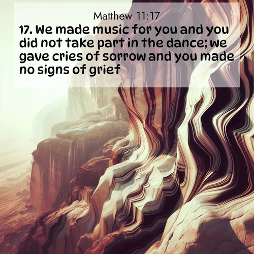 BBE Gospel of Matthew 11:17 overlaying nature image scene: Desert varnish stains cliff faces in abstract patterns.;17. We made music for you and you did not take part in the dance; we gave cries of sorrow and you made no signs of grief.