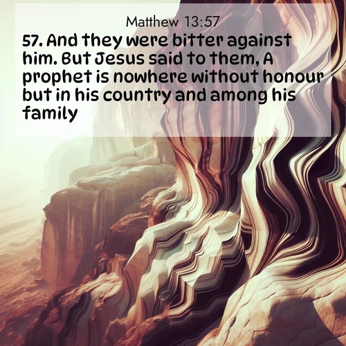 BBE Gospel of Matthew 13:57 overlaying nature image scene: Desert varnish stains cliff faces in abstract patterns.;57. And they were bitter against him. But Jesus said to them, A prophet is nowhere without honour but in his country and among his family.
