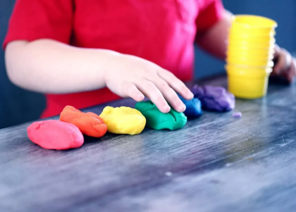 Kids participating in KidsTeam Lausanne-Renens’ ‘Navigators of the Lake’ event, crafting animals, singing together, and enjoying lake-inspired activities in a faith-based, springtime program."