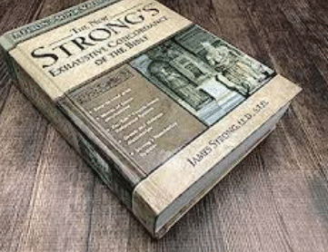 The exhaustive Strong Code book, by James Strong on the table